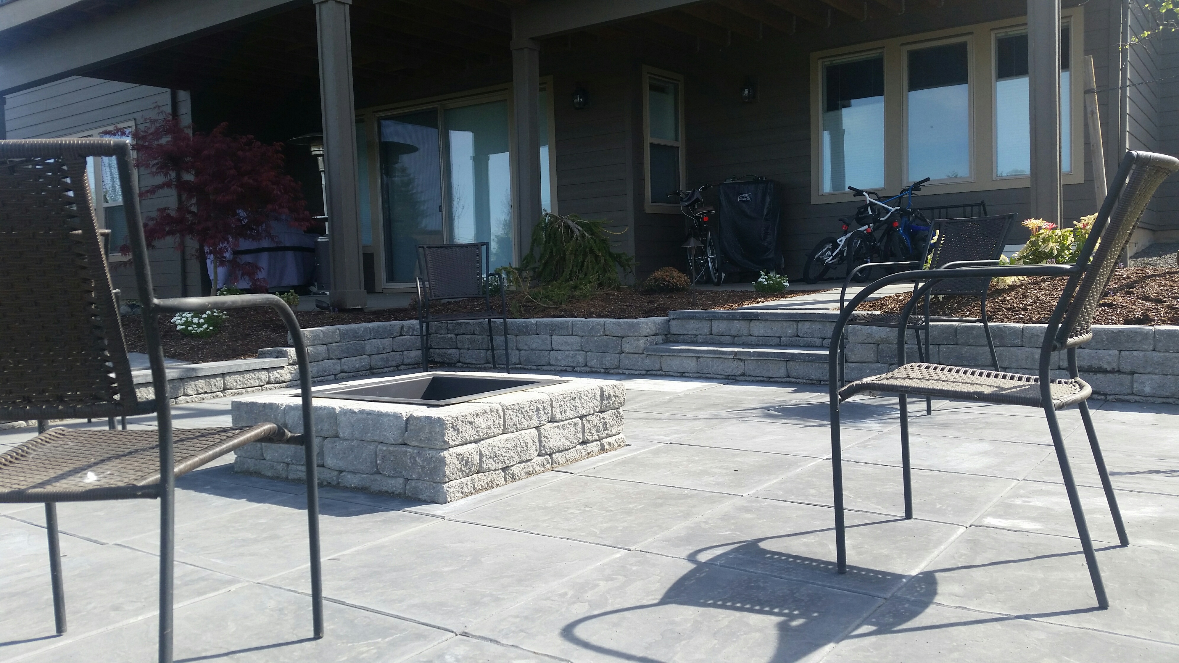 patio with steps and fire pit